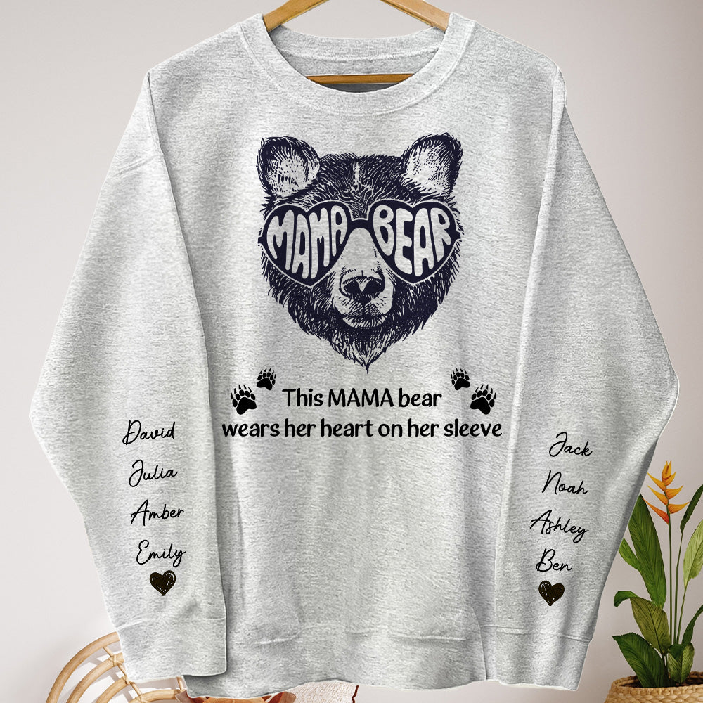 This-Mama-Bear-Wears-Her-Heart-On-Her-Sleeve-Personalized-Sweatshirt_1_8f2f2d65-b38c-448c-bad7-eb0d032954c2.jpg This Mama Bear Wears Her Heart On Her Sleeve - Up To 12 Names - Personalized Sweatshirt - Image 1